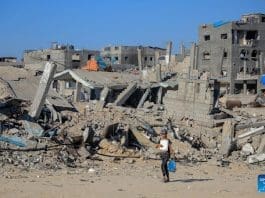 A girl walks past destroyed buildings in the southern Gaza Strip city of Khan Younis, on July 17, 2024. During the past 24 hours, the Israeli military killed 81 people and wounded 198 others, bringing the total death toll to 38,794 and injuries to 89,364 since the Palestinian-Israeli conflict broke out in early October 2023, Gaza-based health authorities said in a statement on Wednesday. (Photo by Rizek Abdeljawad/Xinhua)