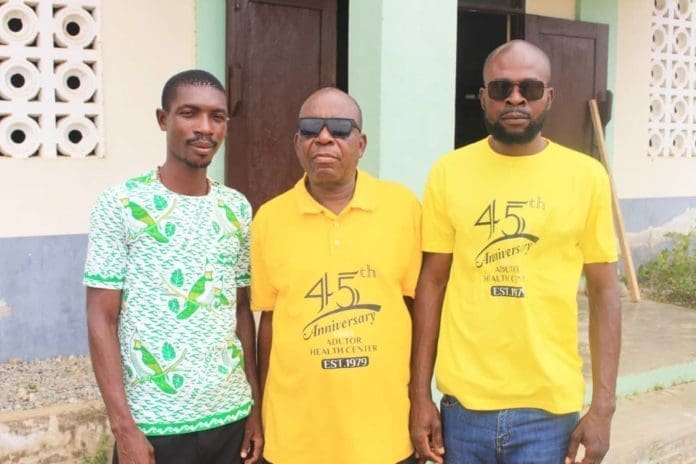 The Quiz Master (in the middle) and His Team The Quiz Master (in the middle) and His Team