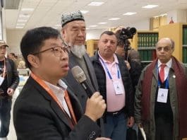 Abudurehep Turmniaz, Dean of the Islamic Institute (second from left) interacting with the journslists