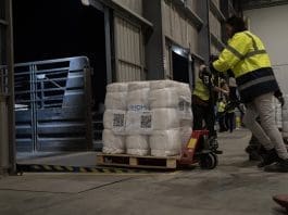 IOM shelter aid is loaded into trucks at the Logistics Cluster warehouse in Amman, Jordan before dispatching to Gaza. Photo: IOM 2025/Clement GIBON