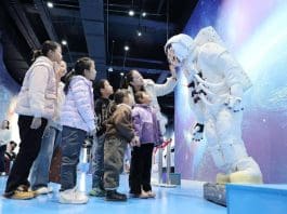 Children learn about the functions and structure of a space suit at a science museum in Zhangye, northwest China's Gansu province, Jan. 17, 2025. (Photo by Zhang Yuan/People's Daily Online)