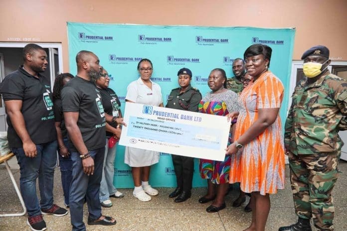 Head Of Public Relations At Prudential Bank Bennet Frimpong Presenting The Cheque To The Acting Head Of The Paediatric Department Of Military Hospital Dr Sheila Asamoah Okyere