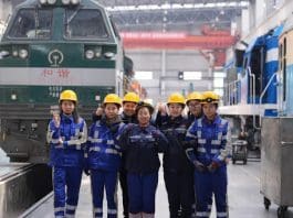 Members of a female maintenance team pose for a group photo at a depot of China Railway Harbin Group Co., Ltd. in Harbin, northeast China's Heilongjiang Province, March 6, 2025. (Xinhua/Wang Song)