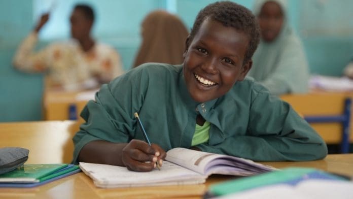 Kid Smiling In Classroom
