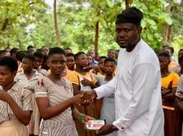 Nkwanta South MCE, Hon. Joseph Awal Antwi (Right), Presenting A Mathematical Set To One Of The BECE Candidates