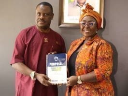 Michael Sarpong President Of Crag Presenting The Proposal Document To The Minister Of Tourism Arts And Culture Dzifa Abla Gomashie