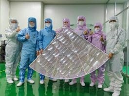 Researchers from Nanjing University pose for a picture with the radiative cooling material they developed.