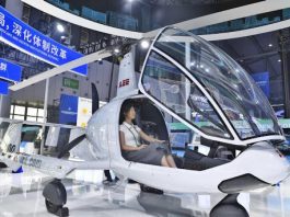 A visitor sits in an aircraft displayed at the Second Belt and Road Conference on Science and Technology Exchange held in Chengdu, Sichuan province, on June 11, 2025. [Photo/Xinhua]