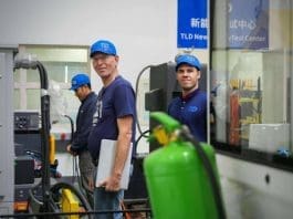 Foreign technicians visit a new energy testing center of TLD Group in Wuxi, east China's Jiangsu province. (Photo by Qian Zhengxian)