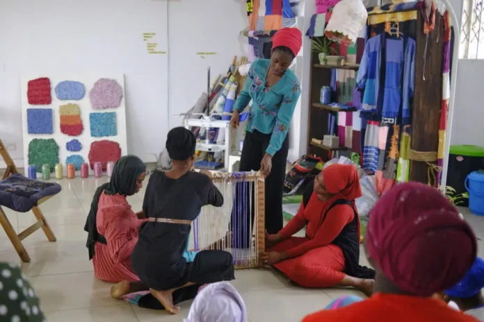 Nabia from The Or Foundation works with Apprentices in the No More Fast Fashion Lab. Image: Photo by Alhassan Fatawu, courtesy of The Or Foundation Nabia from The Or Foundation works with Apprentices in the No More Fast Fashion Lab. Image: Photo by Alhassan Fatawu, courtesy of The Or Foundation