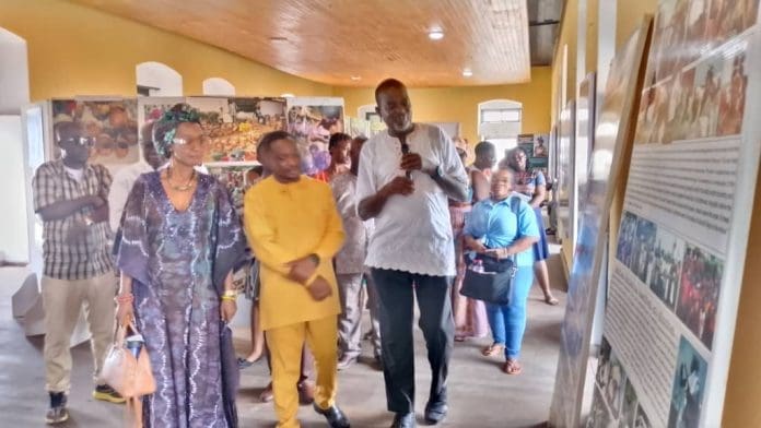 CEO Of Black Star Photo Exhibition, Thomas Fynn, Shows Pictures At His Cape Coast Castle Exhibition Ground